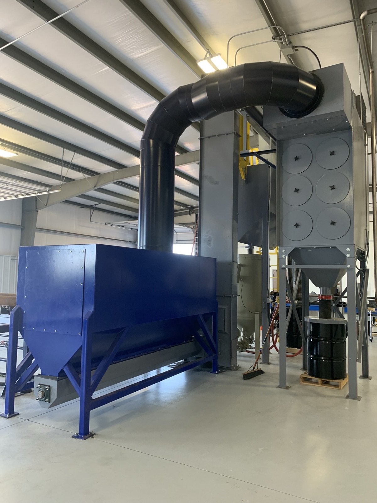 Abrasive storage hopper with ductwork to a cartridge dust collector