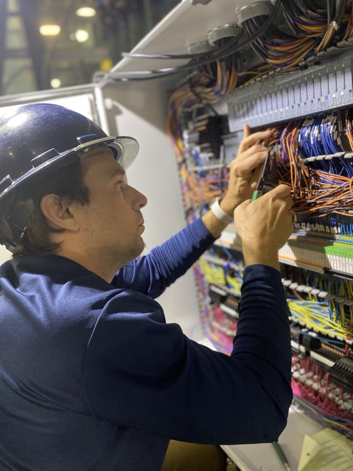 CTX Automation engineer terminating field wiring in a control panel